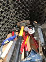 Box of miscellaneous tools and rubber mats