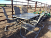 Glass top patio table with 6 arm chairs