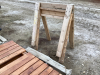 Two wood sawhorses. Wood walkway