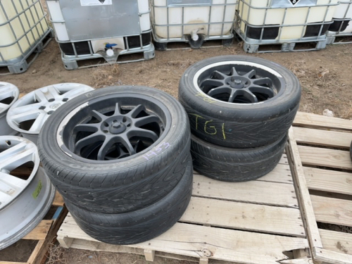 Four Kumo car tires on rims