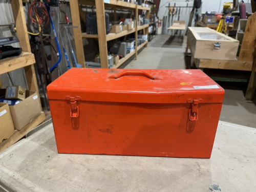 Orange tool box w/ wrenches