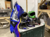 HELMETS AND 2 YOUTH SIZE MOTO CROSS PANTS