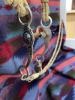 Hand, braided rawhide bridal with reins, and Longshank cricket bit - 3