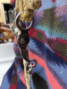 Hand, braided rawhide bridal with reins, and Longshank cricket bit - 5