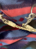 Hand, braided rawhide bridal with reins, and Longshank cricket bit - 8