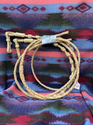 Hand, braided rawhide reins