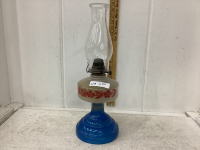 OIL LAMP WITH BLUE BASE AND RED FLORAL DESIGN OF RESERVOIR