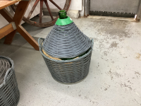 LARGE ROUNDED GREEN DEMIJOHN CARBOY IN BASKET