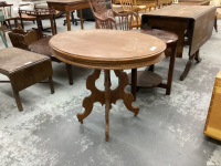 OVAL TOP SMALL TABLE ON STEEL CASTERS