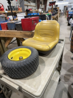 Lawnmower, seat and wheel