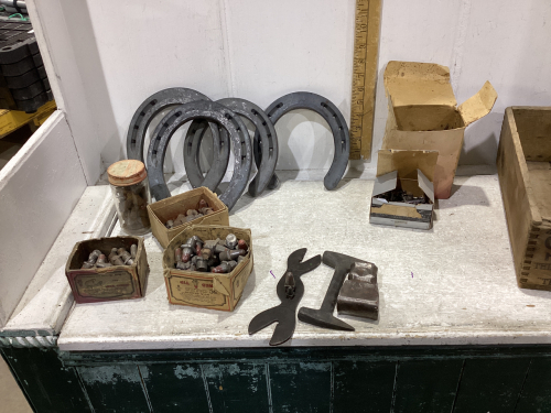 WOOD BOX W/HORSE SHOES, CAULKS, HORSE SHOE NAILS, TOOLS