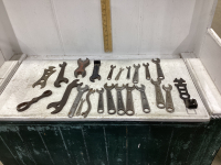 BOX WITH ASSORTED ANTIQUE WRENCHES