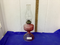 REDDISH COLORED OIL LAMP