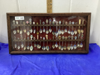 COLLECTOR SPOONS IN DISPLAY