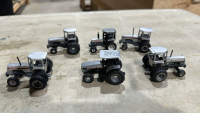 Six Miniature White Tractors