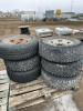 Pallet of six truck tires on rims