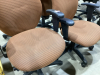 (2)USED ROLLING OFFICE CHAIRS - ORANGE/BROWN TONES - 2