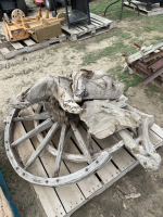 Pallet of driftwood and broken wagon wheel