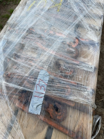 Nine Boomers on a pallet and covered with plastic