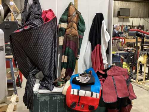 SHELF 3: 2 BINS FILLED W/ HALLOWEEN COSTUMES