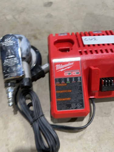 Milwaukee 12v and 18 V battery battery charger plus a pneumatic palm sander