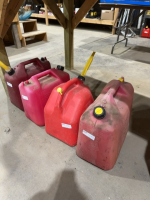 Four plastic Jerry cans