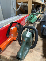 Two electric hedge trimmers