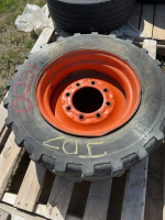 Skid steer, tire and rim