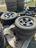 Set of four tires on 5 bolt Ford rims