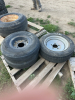 Pallet of three tires On rims