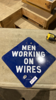 “MEN WORKING ON WIRES” SIGN