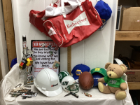 BOX W/ SPORT COLLECTIBLES - SASKATCHEWAN MINI FOOTBALL HELMETS, BUDWEISER BAGS, “GUN” VODKA BOTTLE, POCKET KNIFE, BALL CAPS