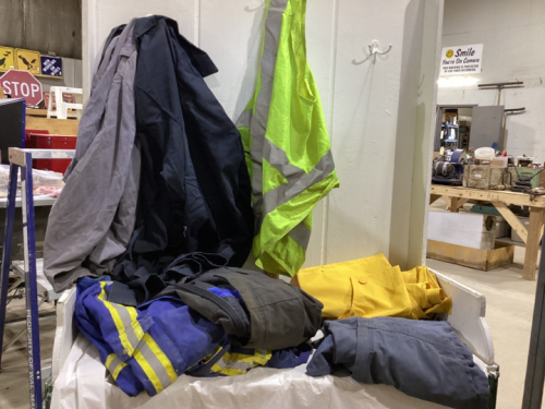 BOX OF FR COVERALLS, JACKETS, RAIN BIBS