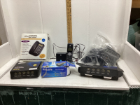 BOX W/ CORDLESS PHONES, LAPTOP BATTERY, AIR PUMP, LAPTOP ADAPTER