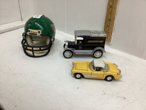 (3) COLLECTIBLE ITEMS - ERTL JD 1913 MODEL T VAN MONEY BANK, 1957 CORVETTE CAR, ROUGHRIDERS MINI HELMET