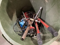 GREEN GARBAGE CAN W/CAULKING GUN, BOLT CUTTERS, COPPER PIPE, TIRE IRON