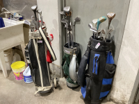 3 GOLF BAGS WITH ASSORTED CLUBS - ONE WITH HAND CART