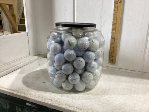 CONTAINER OF GOLF BALLS - USED