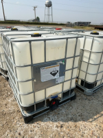 Poly tank in metal crib with lid and valve