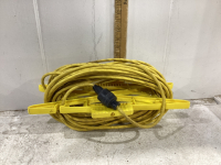 YELLOW EXTENSION CORD ON HOLDER