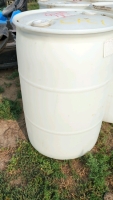 Five sealed poly barrels