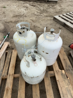 Three propane cylinders