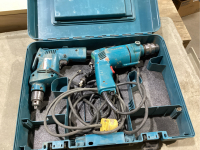 CASE WITH 2 CORDED MAKITA DRILLS