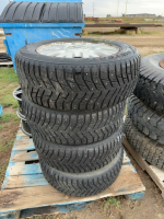 Four snow tires on mercury rims