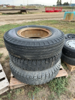 Three mismatched transport tires on split rims