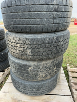 Set of four truck tires on Boss rims