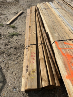 Bundle of treated 10 foot 4/5 deck boards