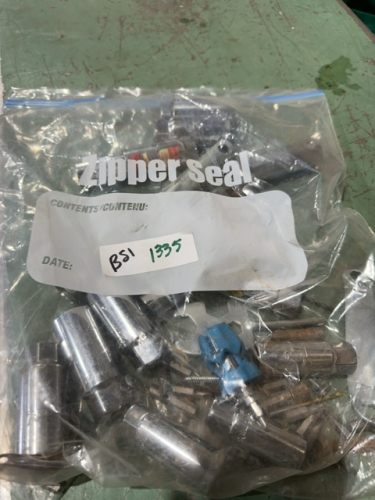 Bag of miscellaneous, spark, plug, long sockets and driver bits