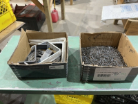 Two boxes, finishing nails and brackets