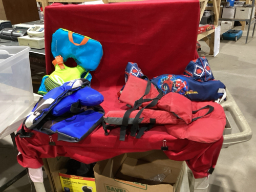 TOTE OF LIFE JACKETS AND FLOATATION GEAR